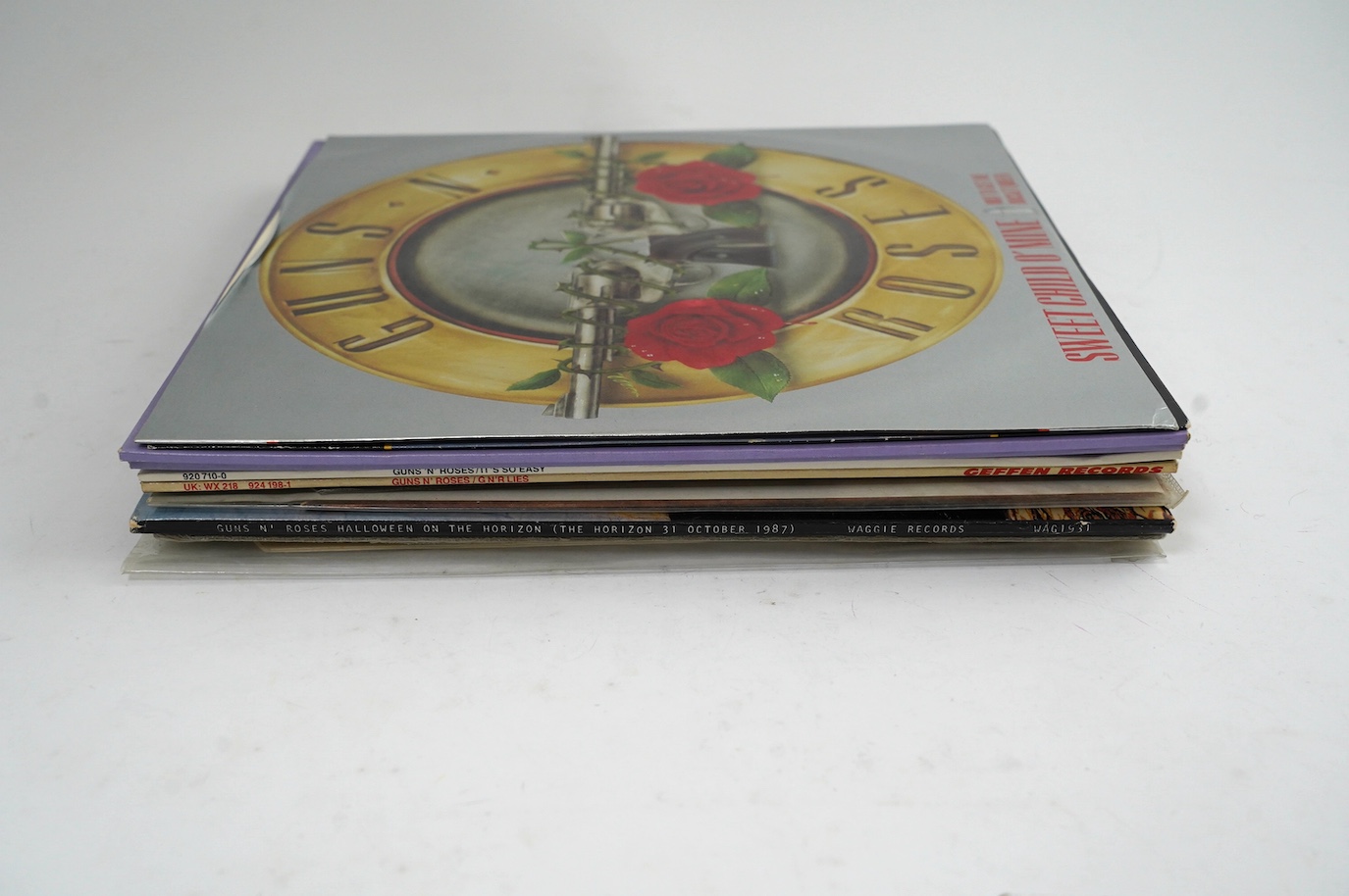 Twelve Guns n’ Roses LP albums, 12” singles and picture discs, including; Welcome to the Jungle, Sweet Child O’ Mine, It’s So Easy, Patience, Paradise City on gun-shaped 7” picture disc, Night Chain on gun-shaped picture